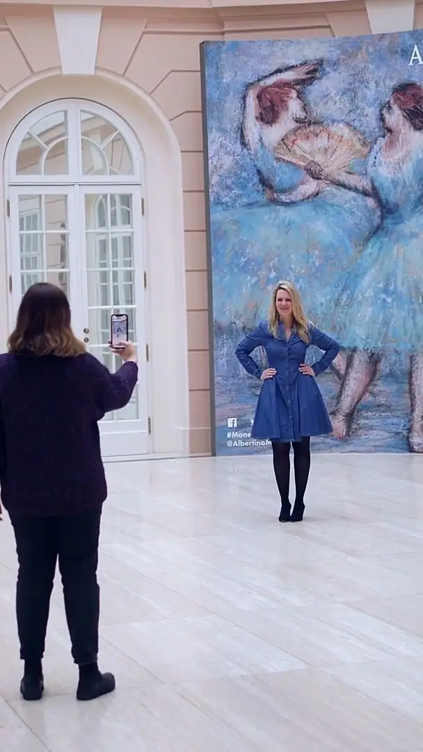 Degas dancers step out of a printed wall at the Albertina, seen on a phone