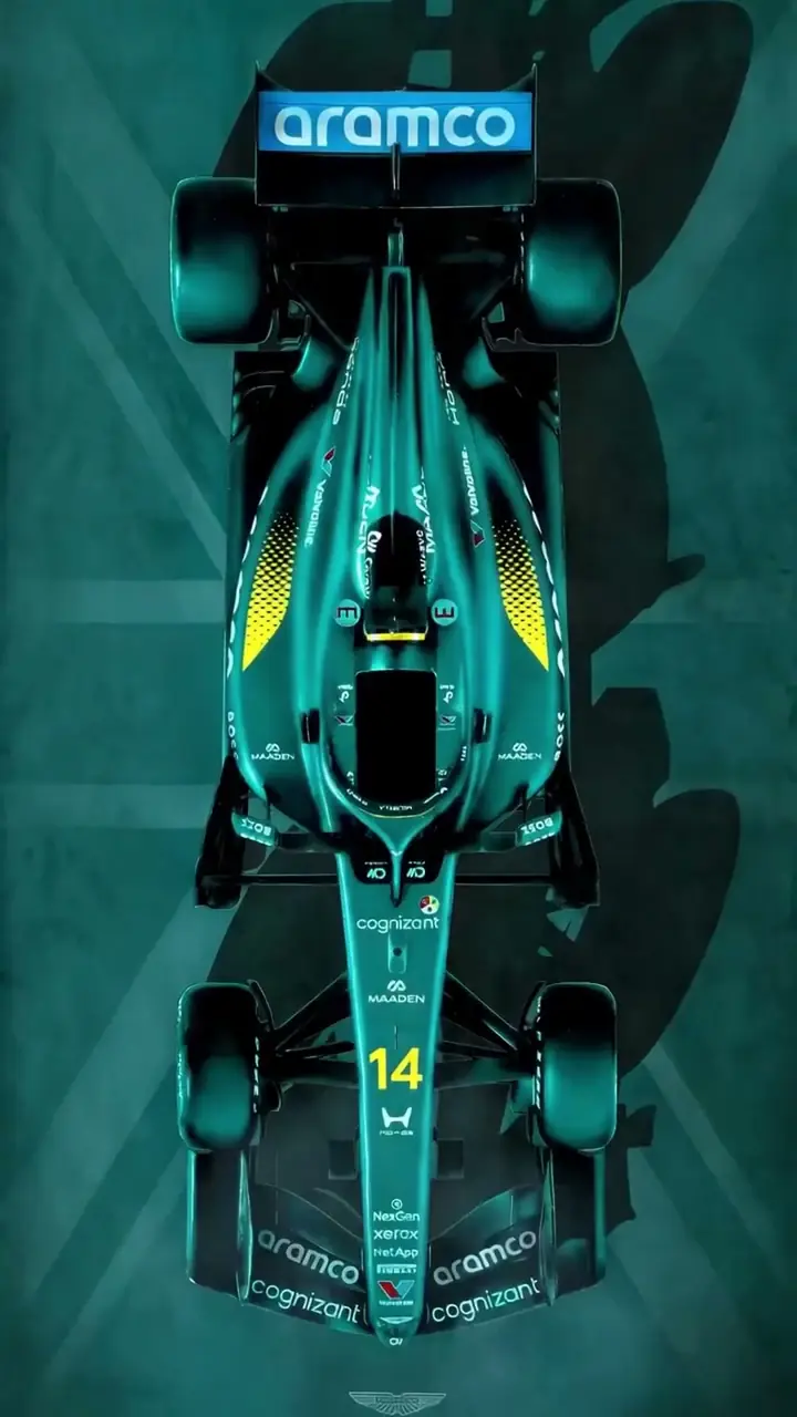 A velvet painting of the Aston Martin Formula One car by Hayden Bone Studio, its AR layer playing on a phone