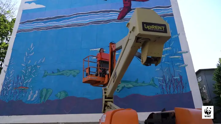 A blue sea mural by Boris Bare for WWF Adria on an apartment block in Zagreb
