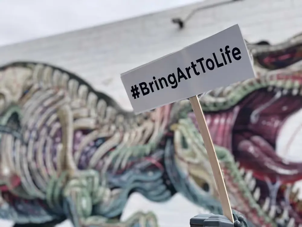 Viral T-Rex street art mural brought to life in augmented reality with Artivive